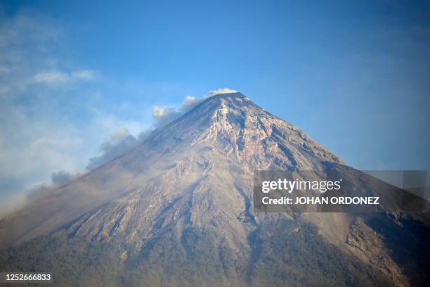 Plume of ash and smoke rises from the Fuego volcano as seen from Alotenango, Guatemala, on May 5, 2023. - Guatemalan authorities evacuated more than...