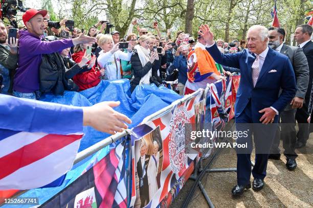 King Charles III meets well-wishers during a walkabout on the Mall outside Buckingham Palace ahead of his and Camilla, Queen Consort's coronationon...