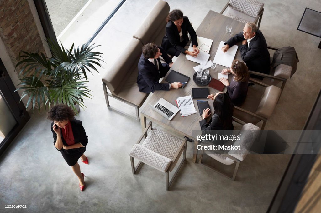 Team of financial advisors planning with business colleagues during meeting at law firm