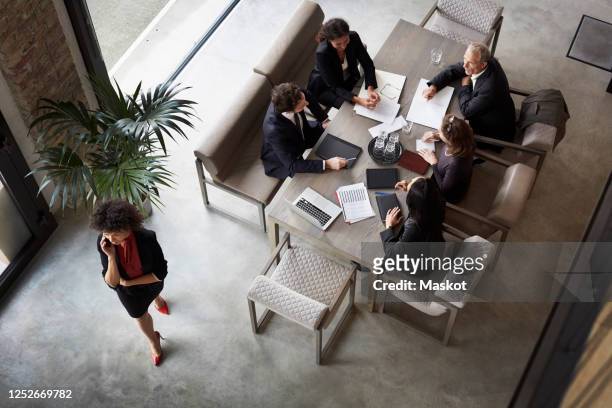 team of financial advisors planning with business colleagues during meeting at law firm - law stock pictures, royalty-free photos & images