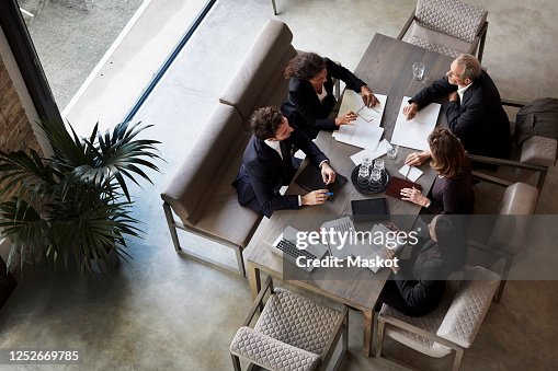 Team of lawyers planning with business colleagues during meeting at law firm Team of lawyers planning with business colleagues during meeting at law firm