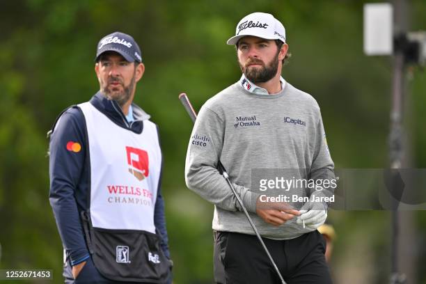 Cameron Young and his caddie, Paul Tesori, step onto the 15th tee box together during the second round of the Wells Fargo Championship at Quail...