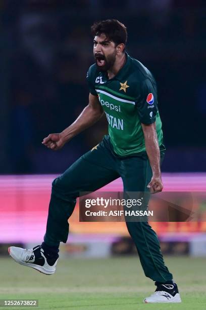 Pakistan's Haris Rauf celebrates after taking the wicket of New Zealand's Tom Blundell during the fourth one-day international cricket match between...