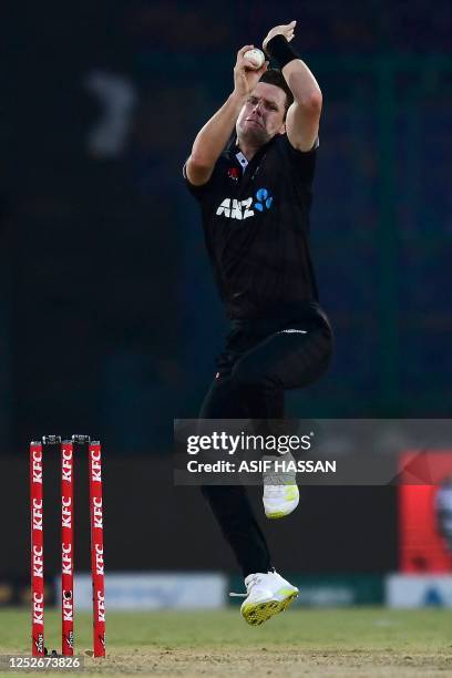 New Zealand's Matt Henry bowls during the fourth one-day international cricket match between Pakistan and New Zealand at the National Stadium in...