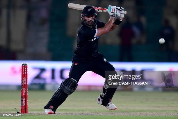 New Zealand's Daryl Mitchell plays a shot during the fourth one-day international cricket match between Pakistan and New Zealand at the National...
