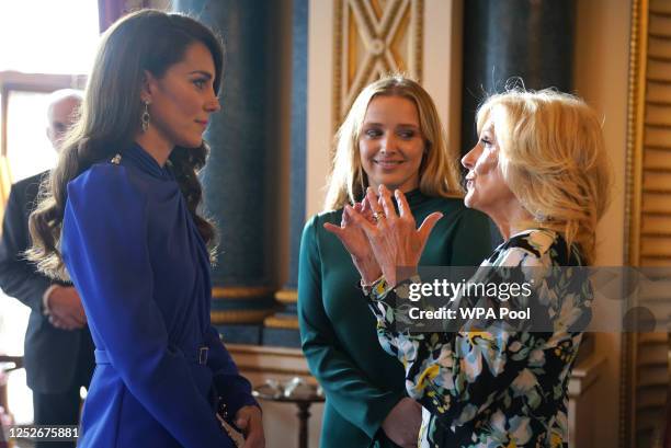 Catherine, Princess of Wales speaks with the First Lady of the United States, Dr Jill Biden and her grand daughter Finnegan Biden during a reception...