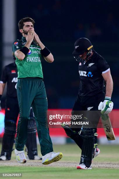 Pakistan's Shaheen Shah Afridi celebrates after taking the wicket of New Zealand's captain Tom Latham during the fourth one-day international cricket...