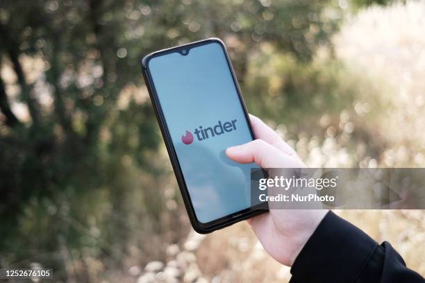 In this photo illustration a Tinder logo seen displayed on a smartphone screen in Athens, Greece on May 5, 2023.