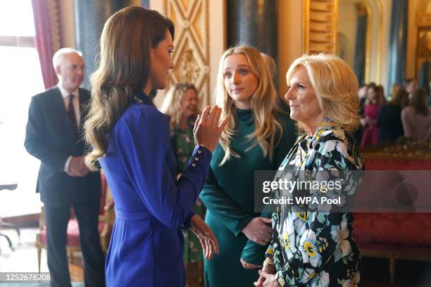 Catherine, Princess of Wales speaks with the First Lady of the United States, Dr Jill Biden and her grand daughter Finnegan Biden during a reception...