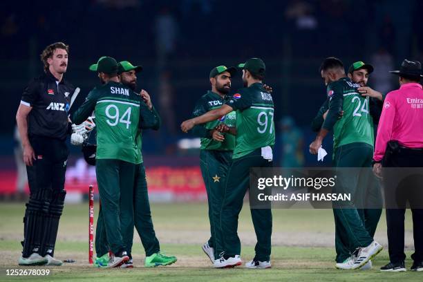 Pakistan's cricketers celebrate after winning the fourth one-day international cricket match between Pakistan and New Zealand at the National Stadium...