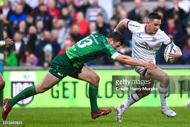 Belfast , United Kingdom - 5 May 2023; James Hume of Ulster is tackled by Tom Farrell of Connacht during the United Rugby Championship Quarter-Final...