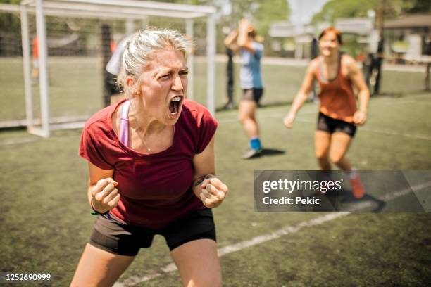 female soccer team winning the match - women's soccer stock pictures, royalty-free photos & images