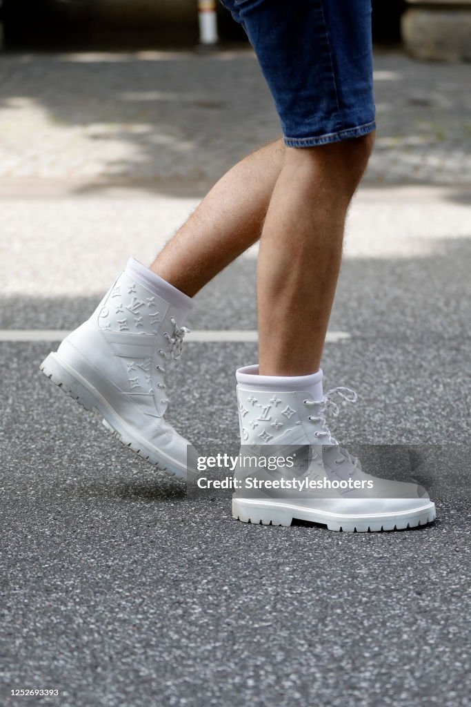 White landscape ankle boots by Louis Vuitton as a detail of