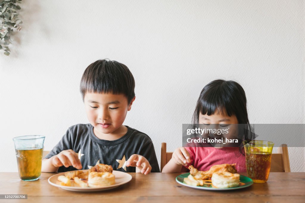 Children having lunch at home