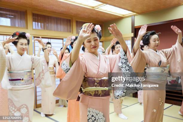 female dancers rehearsing bon festival dance, wearing kimonos - chuo ward tokyo stock pictures, royalty-free photos & images