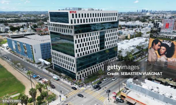 This aerial view shows writers and their supporters walk the picket line outside the Netflix offices in Hollywood, California, on day four of the...