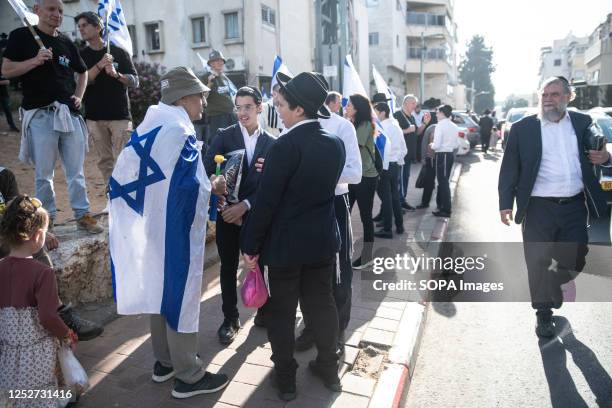 Israeli reservists against the judicial reform with Israeli flags debate with Bnei Brak orthodox residents during a protest against Haredi IDF...