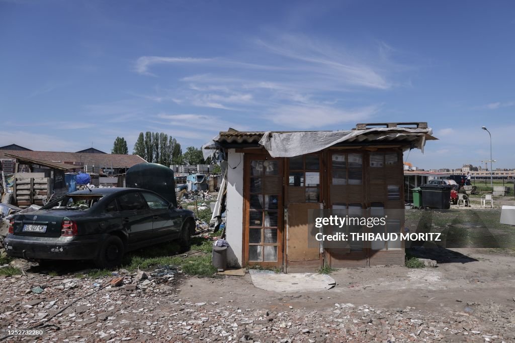 Poverty In France This photograph taken on April 21 shows a car wreck next to a shack ...