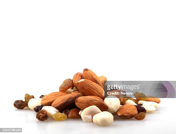 image of raw nuts isolated on white - almonds on white stock-fotos und bilder