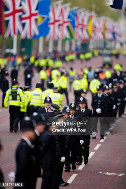 Police gather along the Mall ahead of the Coronation of King Charles III and Queen Camilla on May 6, 2023 in London, England. The Coronation of...