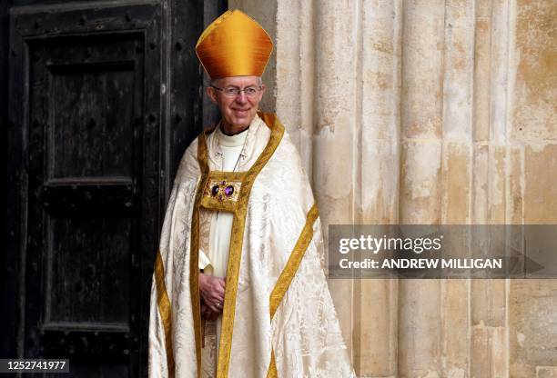 Archbishop of Canterbury Justin Welby smiles at Westminster Abbey in central London on May 6 ahead of the coronations of Britain's King Charles III...