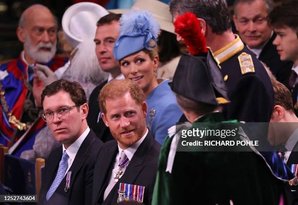 Britain's Prince Harry, Duke of Sussex talks to Britain's Princess Anne, Princess Royal at Westminster Abbey in central London on May 6 ahead of the...