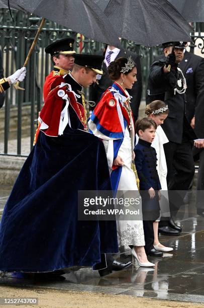 Prince William, Catherine, Princess of Wales, and their children Princess Charlottte and Prince Louis arrive at the Coronation of King Charles III...