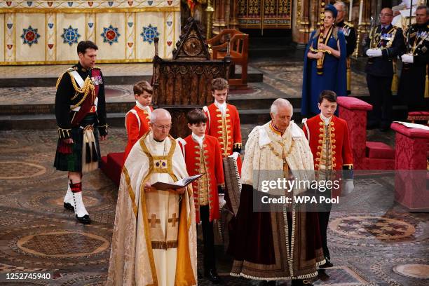 Prince George with King Charles III during the Coronation of King Charles III and Queen Camilla on May 6, 2023 in London, England. The Coronation of...