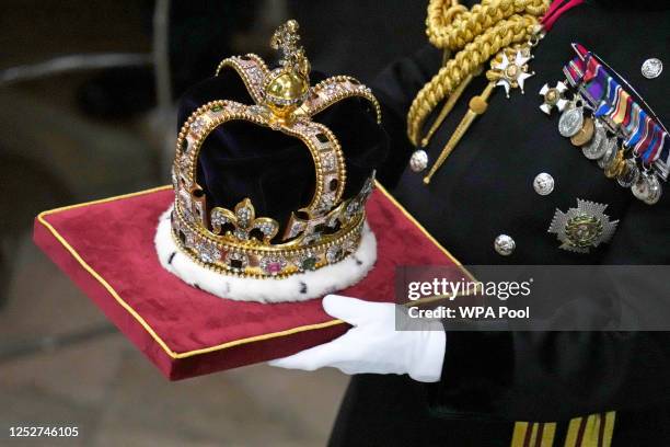 17th Century St Edward's Crown is carried ahead of the Coronation of King Charles III and Queen Camilla at Westminster Abbey on May 6, 2023 in...