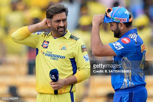 Chennai Super Kings' Mahendra Singh Dhoni and Mumbai Indians' Rohit Sharma talk during the toss before the start of the Indian Premier League...