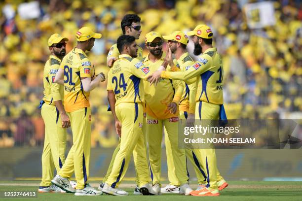 Chennai Super Kings' Tushar Deshpande celebrates with teammates after the dismissal of Mumbai Indians' Cameron Green during the Indian Premier League...