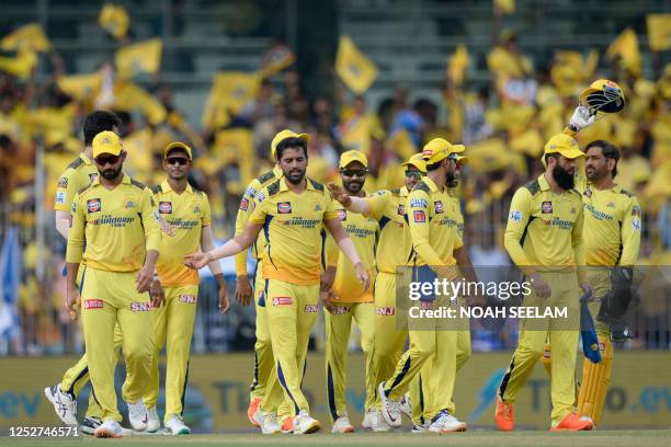 Chennai Super Kings' players celebrate after the dismissal of Mumbai Indians' Rohit Sharma during the Indian Premier League Twenty20 cricket match...