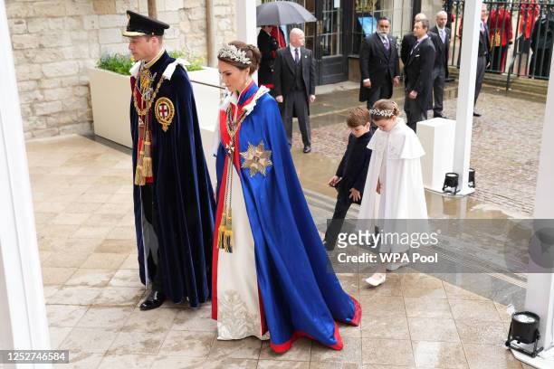 Prince William, Prince of Wales and Catherine, Princess of Wales with Prince Louis and Princess Charlotte arrive ahead of the Coronation of King...