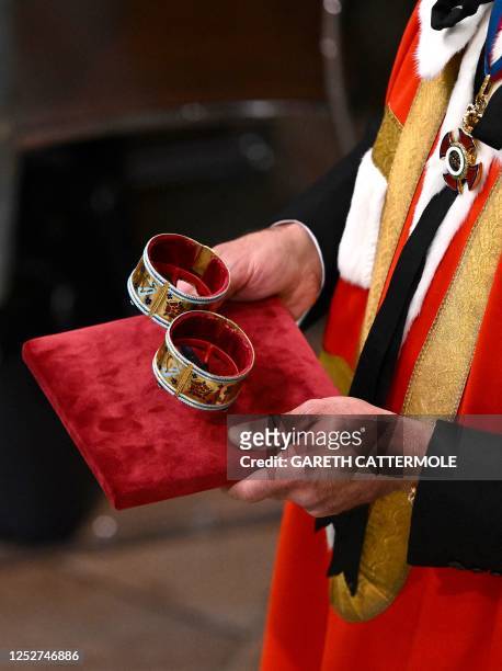 Two Armills, bracelets made from gold, champleve and basse-taille enamel, lined in velvet, is carried at Westminster Abbey in central London on May 6...