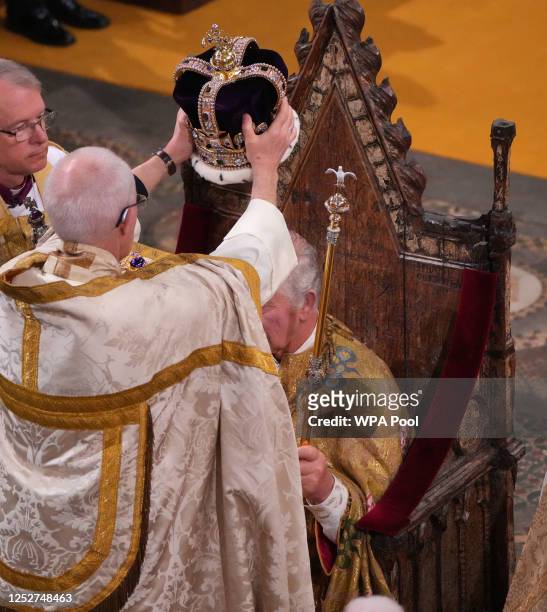 King Charles III is crowned with St Edward's Crown by The Archbishop of Canterbury the Most Reverend Justin Welby during his coronation ceremony in...
