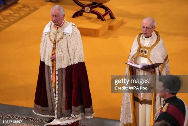 The Archbishop of Canterbury the Most Reverend Justin Welby with King Charles III during his coronation ceremony in Westminster Abbey on May 6, 2023...