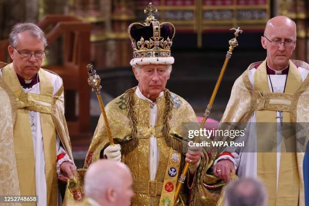 King Charles III stands after being crowned during his coronation ceremony in Westminster Abbey, on May 6, 2023 in London, England. The Coronation of...