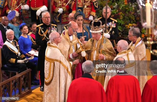 King Charles III after being crowned with the St Edward's Crown by The Archbishop of Canterbury the Most Reverend Justin Welby during his coronation...