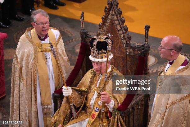 King Charles III after being crowned with St Edward's Crown by The Archbishop of Canterbury the Most Reverend Justin Welby during his coronation...