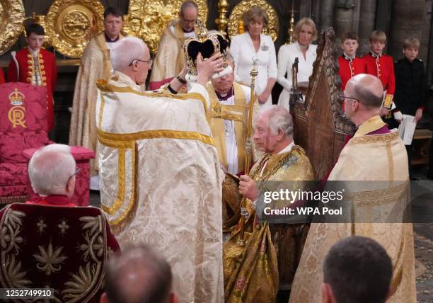 King Charles III is crowned with St Edward's Crown by The Archbishop of Canterbury the Most Reverend Justin Welby during his coronation ceremony in...