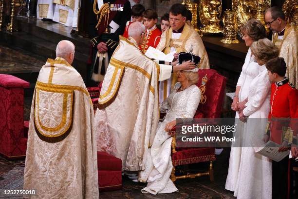 Queen Camilla is crowned with Queen Mary's Crown by The Archbishop of Canterbury the Most Reverend Justin Welby during the Coronation of King Charles...