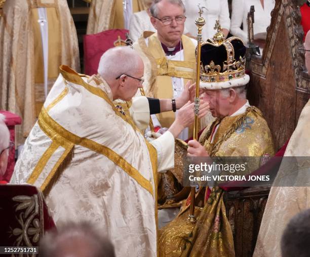 The Archbishop of Canterbury Justin Welby places the St Edward's Crown onto the head of Britain's King Charles III during the Coronation Ceremony...