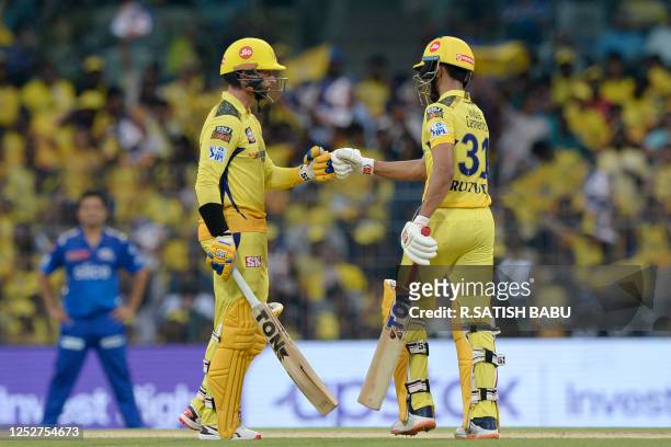 Chennai Super Kings' Ruturaj Gaikwad and Devon Conway bump fists during the Indian Premier League Twenty20 cricket match between Chennai Super Kings...