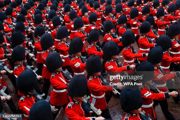 Grenadier Guards march on the day of Britain's King Charles' coronation ceremony, at The Mall on May 6, 2023 in London, England. The Coronation of...