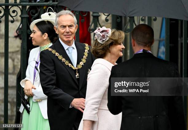 Former British Prime Minister Tony Blair and wife Cherie Blair leave Westminster Abbey following the coronation ceremony of King Charles III and...