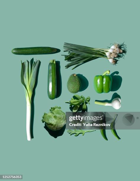 green vegetables on the green background- knolling concept - green vegetable stock pictures, royalty-free photos & images