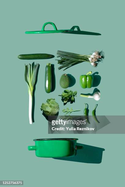 green vegetables on the green background- knolling concept - colour image stock-fotos und bilder