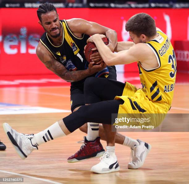 Nick Weiler-Babb of Ludwigsburg is challenged by Rokas Giedraitis of Berlin during the EasyCredit Basketball Bundesliga final first leg match between...