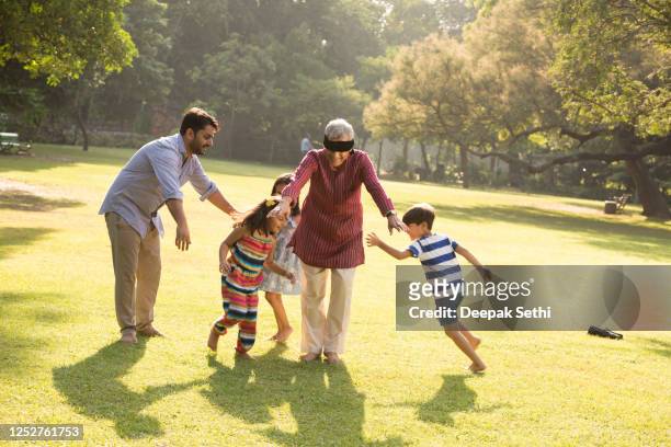 multi generation family - stock images - playing stock pictures, royalty-free photos & images