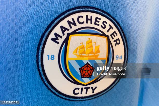 Manchester City logo is seen on a football jersey in this illustration photo taken in a store in Krakow, Poland on May 6, 2023.